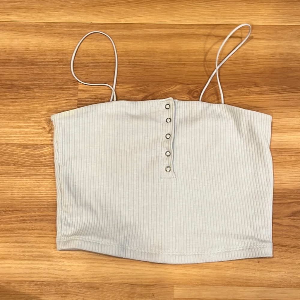 Tank top, light blue color, you can undo the buttons